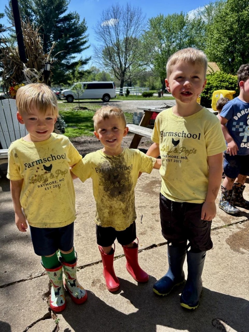 Farmschool kids in their yellow shirts and muddy boots